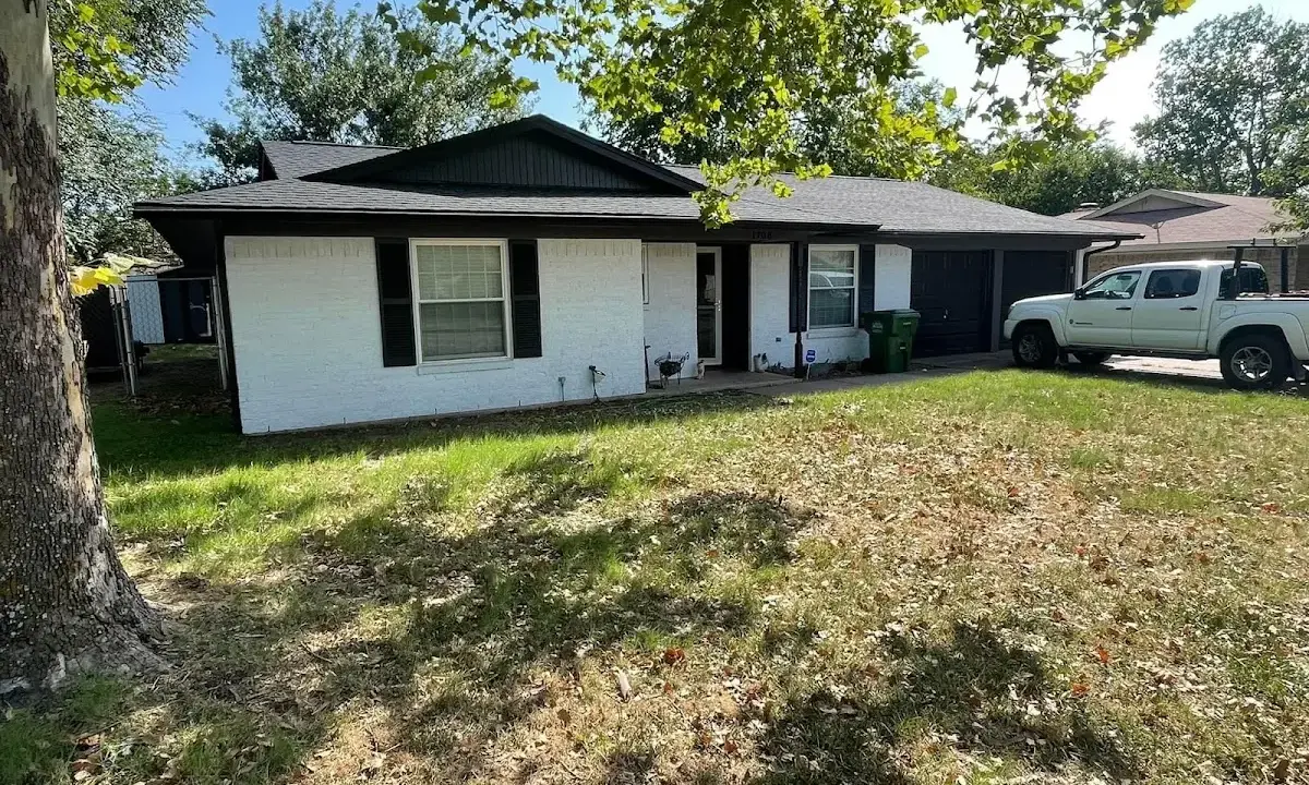 Professional roofing crew working on a residential roof in Collegedale